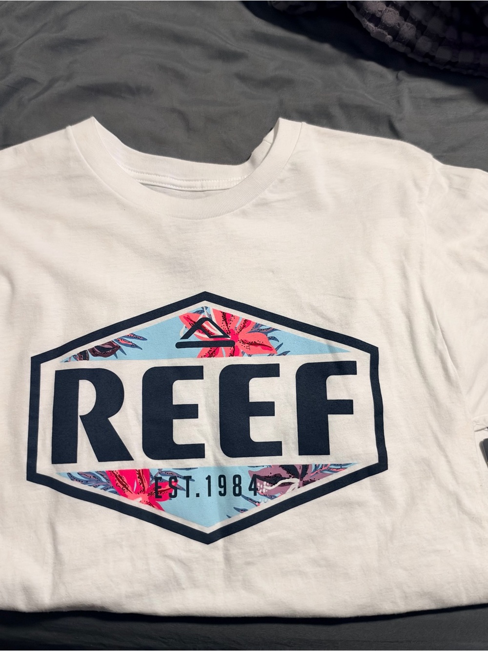 Reef White Short-Sleeve Tee with Navy Logo and Pink Floral Accent